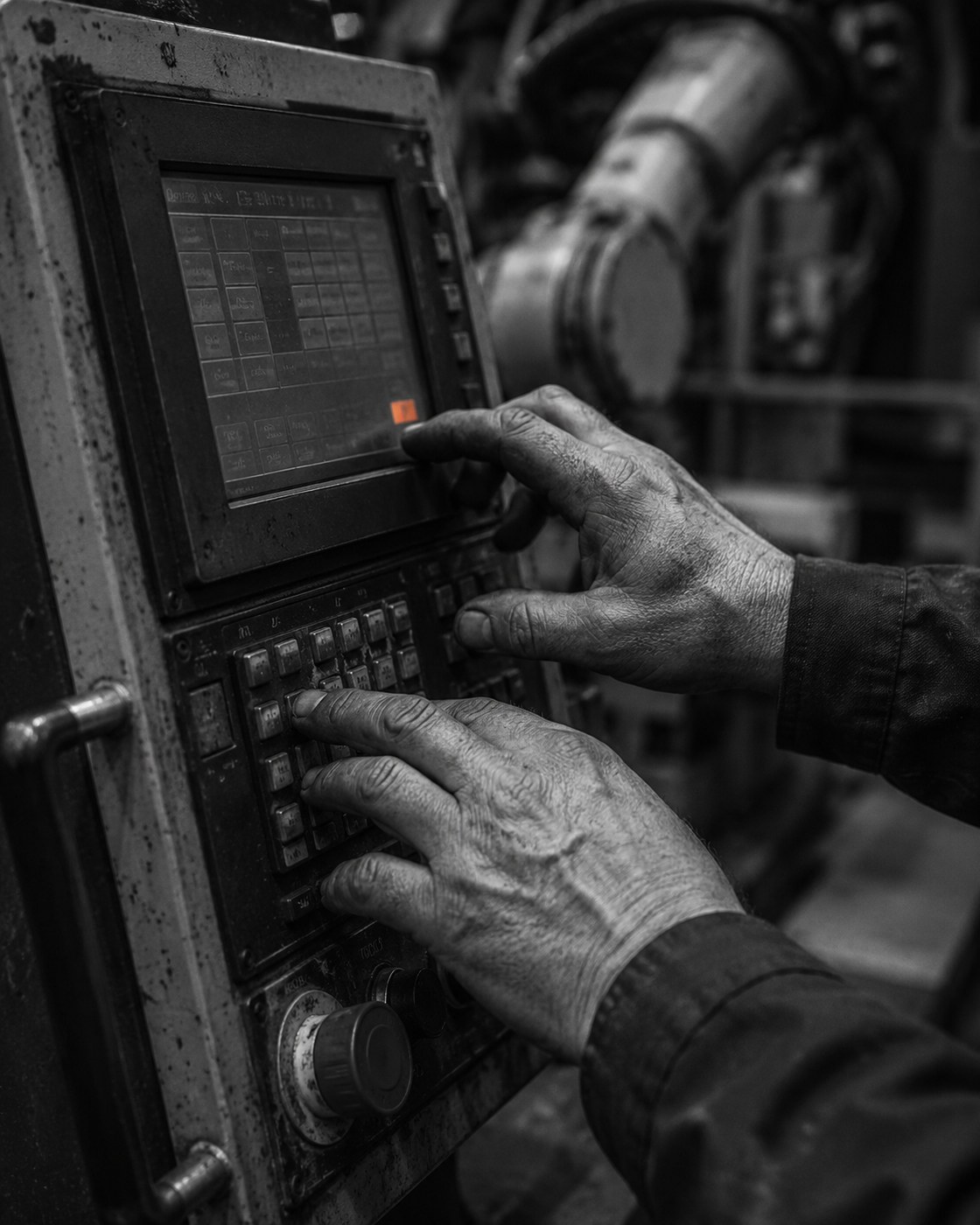 Automation technician working on a gearbox panel